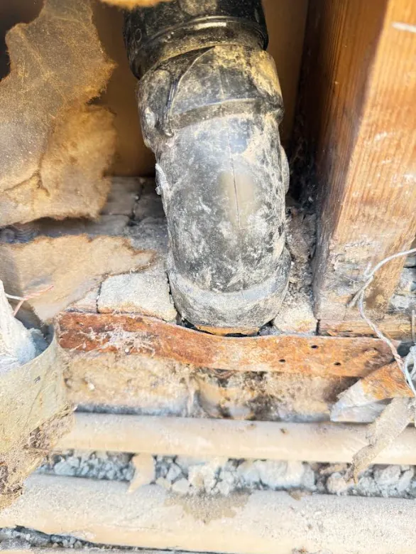 Corroded drain line before repair